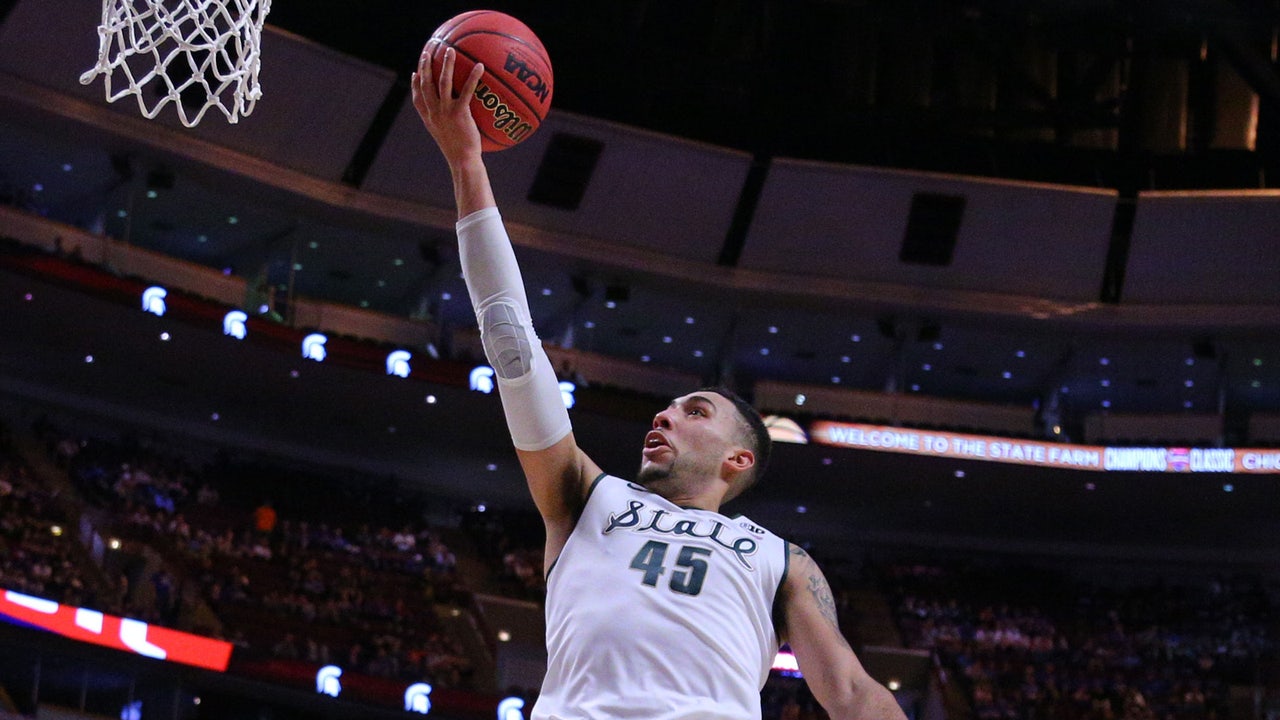Valentine triple-double leads No. 13 Michigan St. over No. 4 Kansas